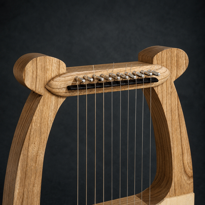 Close-up of the tuning pins, strings, and handcrafted upper frame of David’s Harp