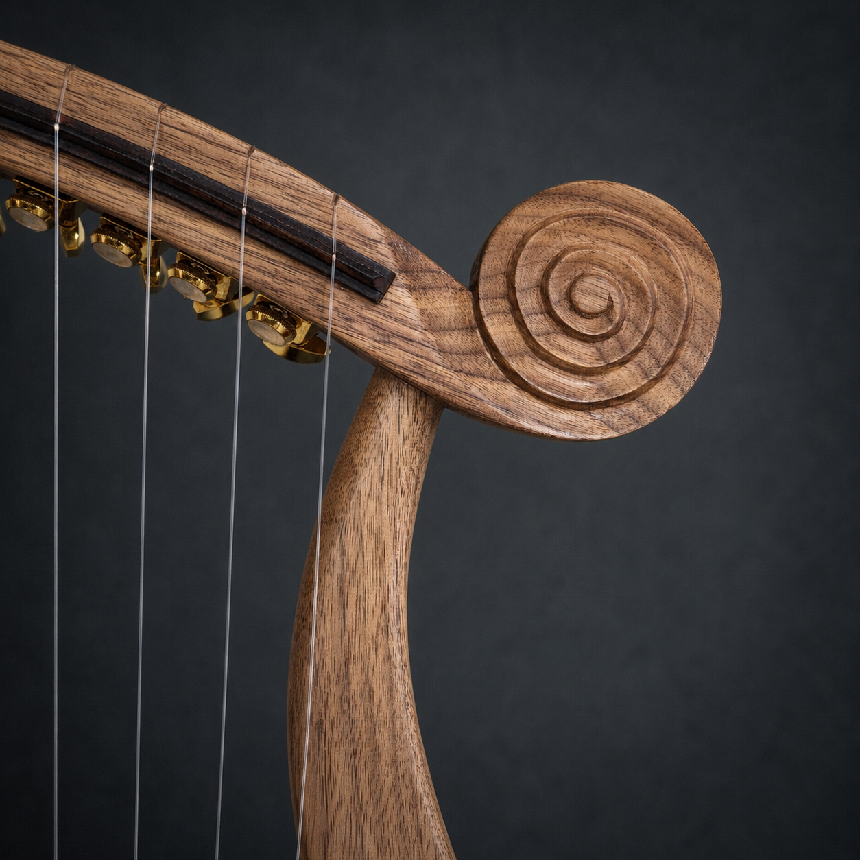 Close-up of the carved right scroll and walnut frame of the Harp of David
