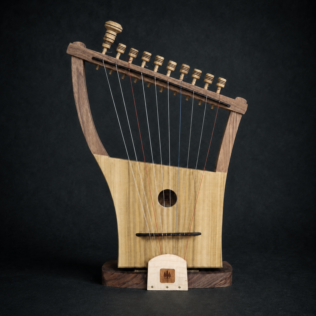 Front view of the handmade 10-string Megiddo Harp displayed on its matching wood stand